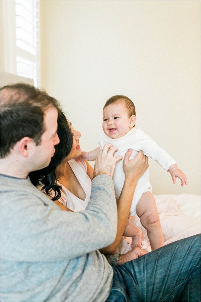 baby laughing at parents 