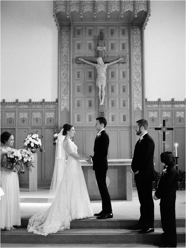 bride and groom saying vows in church