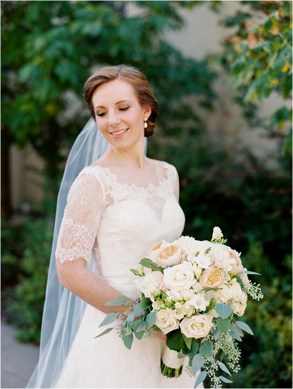 bride holding floral bouquet