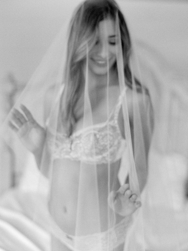 beautiful bride fixing veil