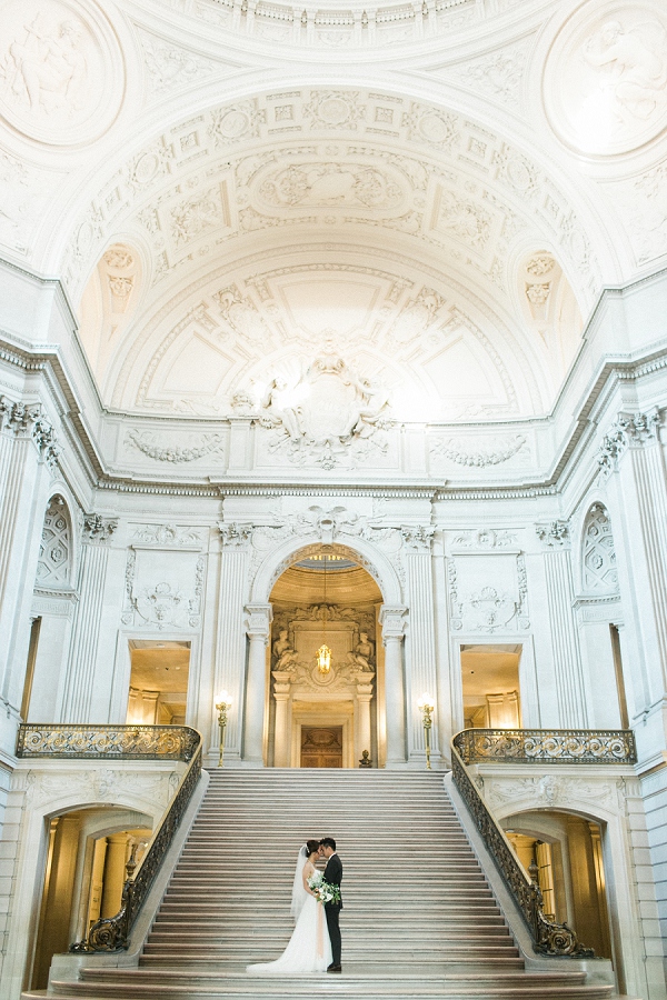 couple kissing in the rotunda at San Francisco city hall