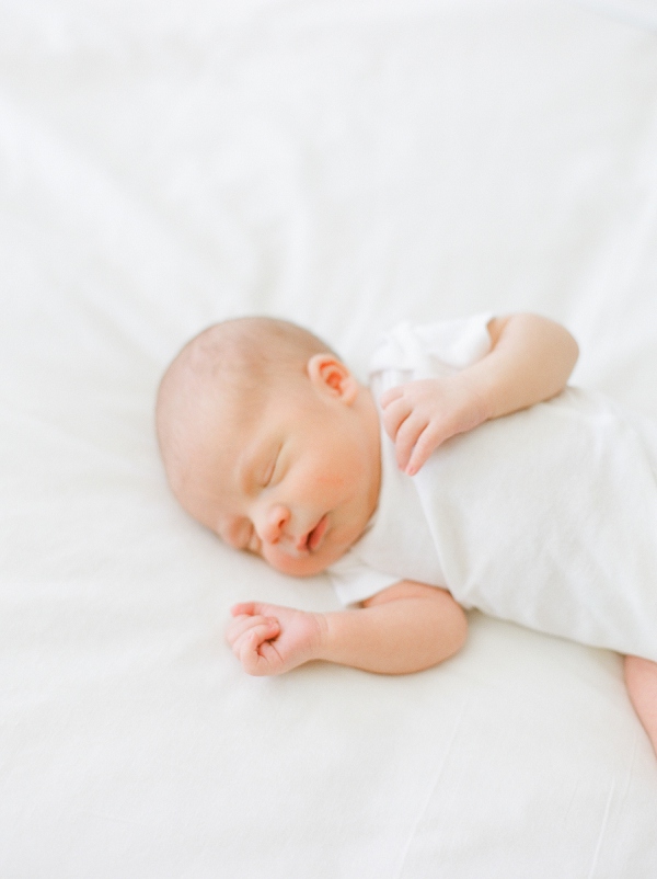 San Francisco newborn photography.  newborn baby laying on a white bed