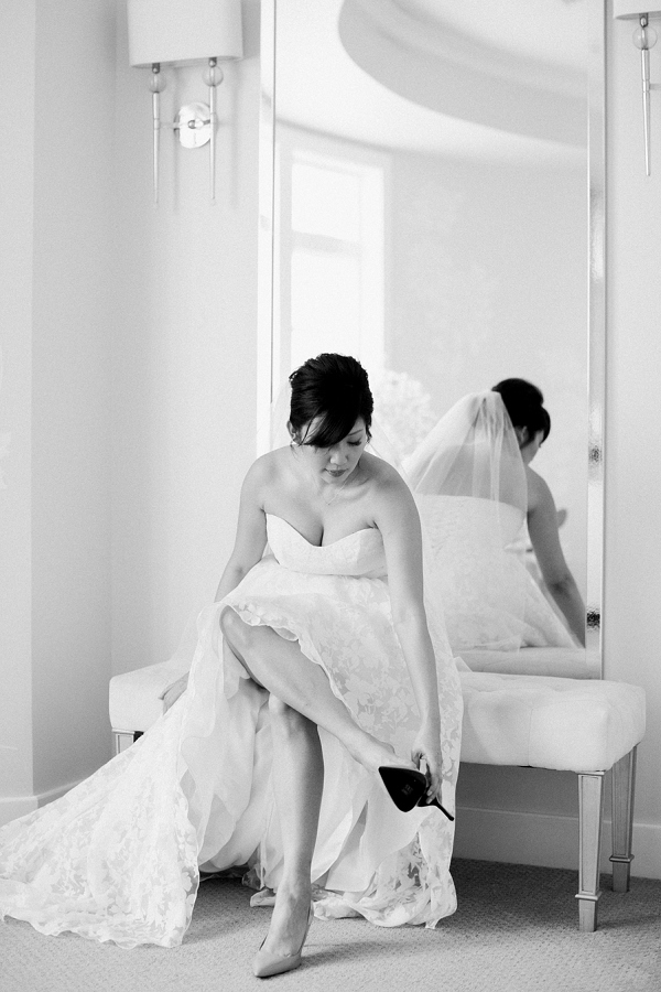 bride putting shoes on 