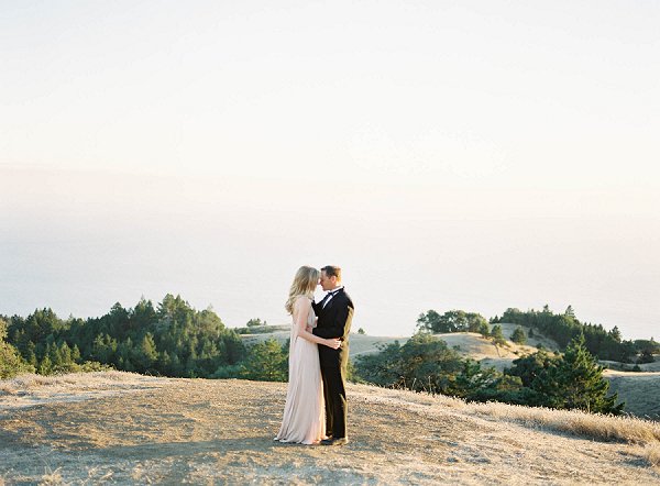 Mt Tam Engagement session. man and woman embracing with warm sunlight.  location near san francisco in marin county.