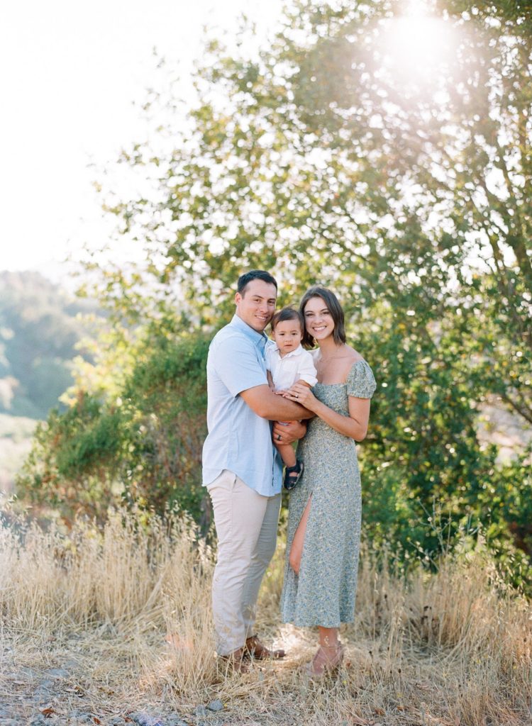 family photography session in Orinda CA father, child, mother with beautiful greenery and tall grasses