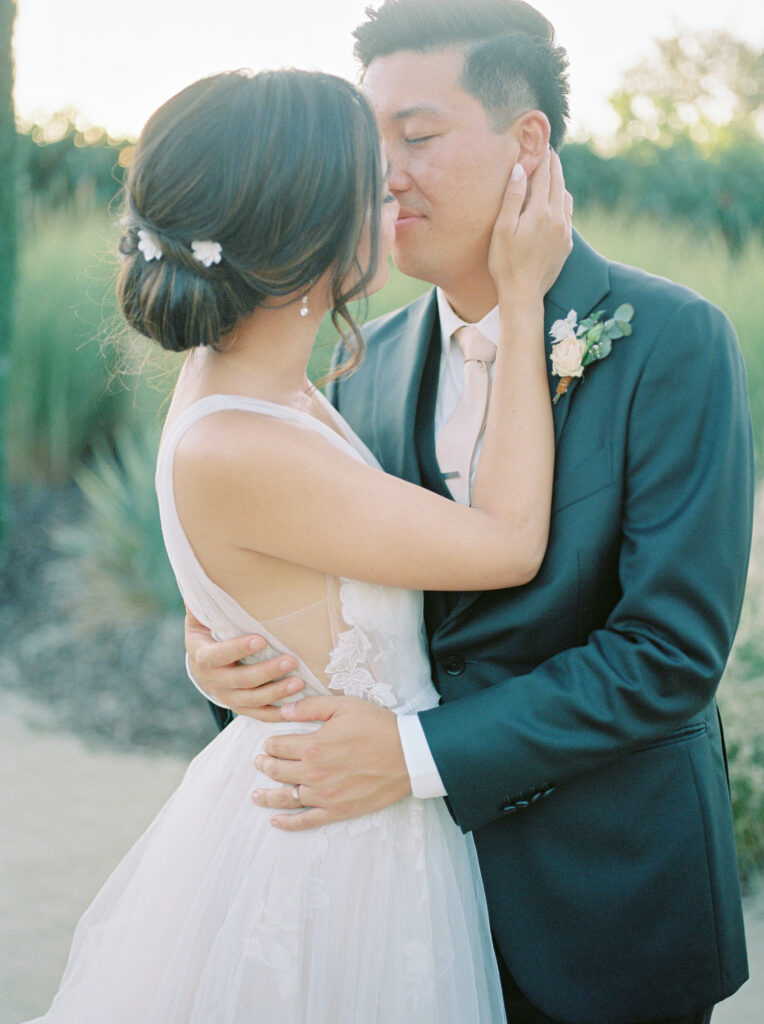 bride and groom kissing. Tres Posti Napa Valley Wedding. 