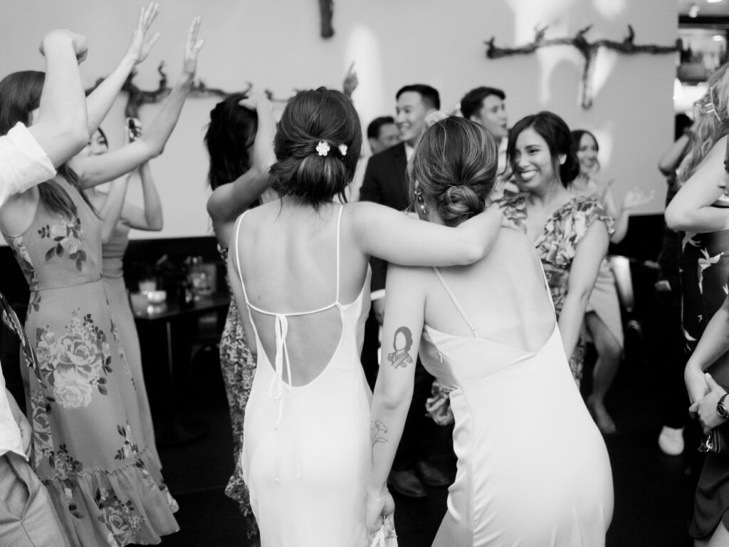 bride dancing with bridesmaids. Tres Posti Napa Valley Wedding. 
