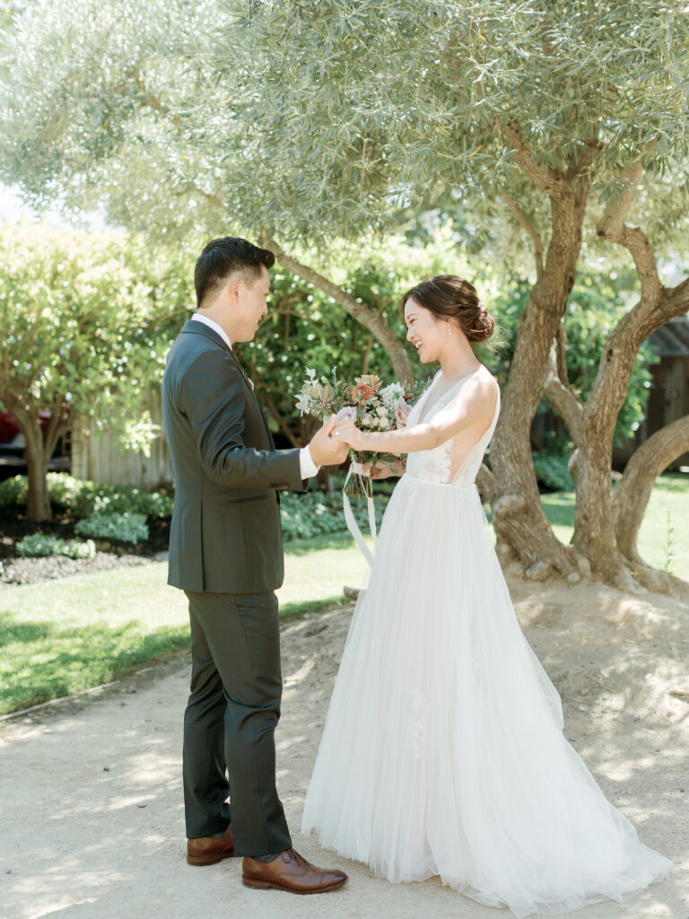 Bride and Groom looking at each other. Tres Posti Napa Valley Wedding