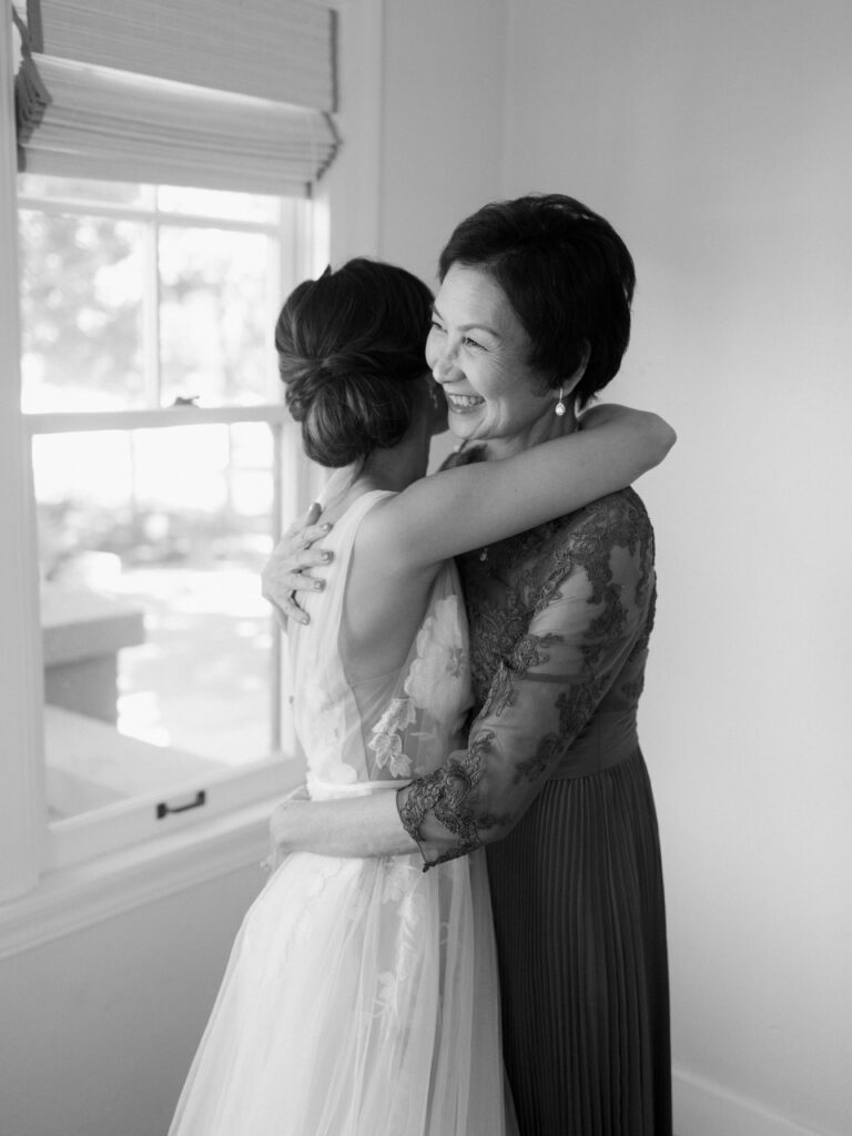 Bride hugging her mother.  Black and white image.  Napa Valley Wedding