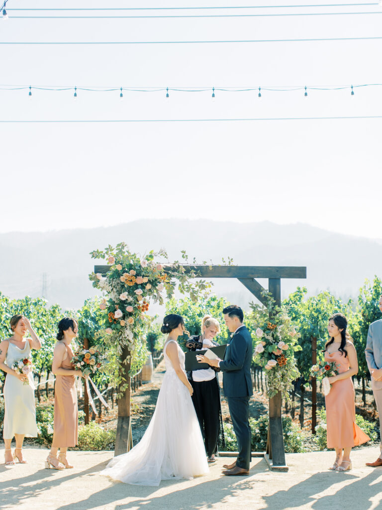 bride and grooms exchanging vows. Tres Posti Napa Valley Wedding