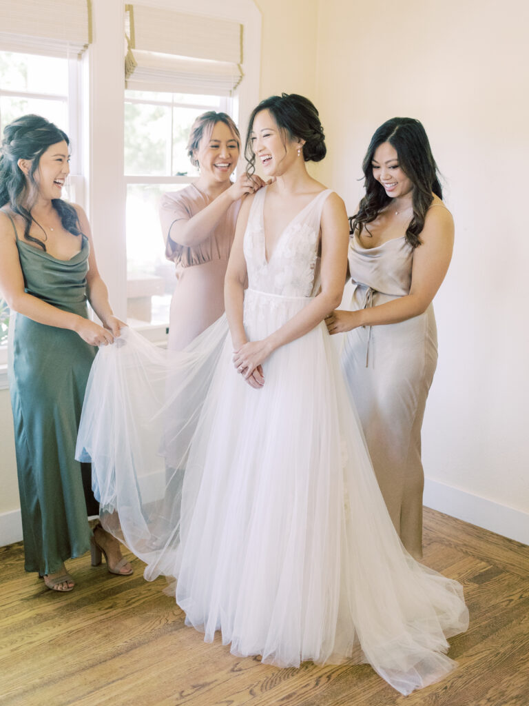 Bride getting ready with three bridesmaids.  Napa Valley Wedding