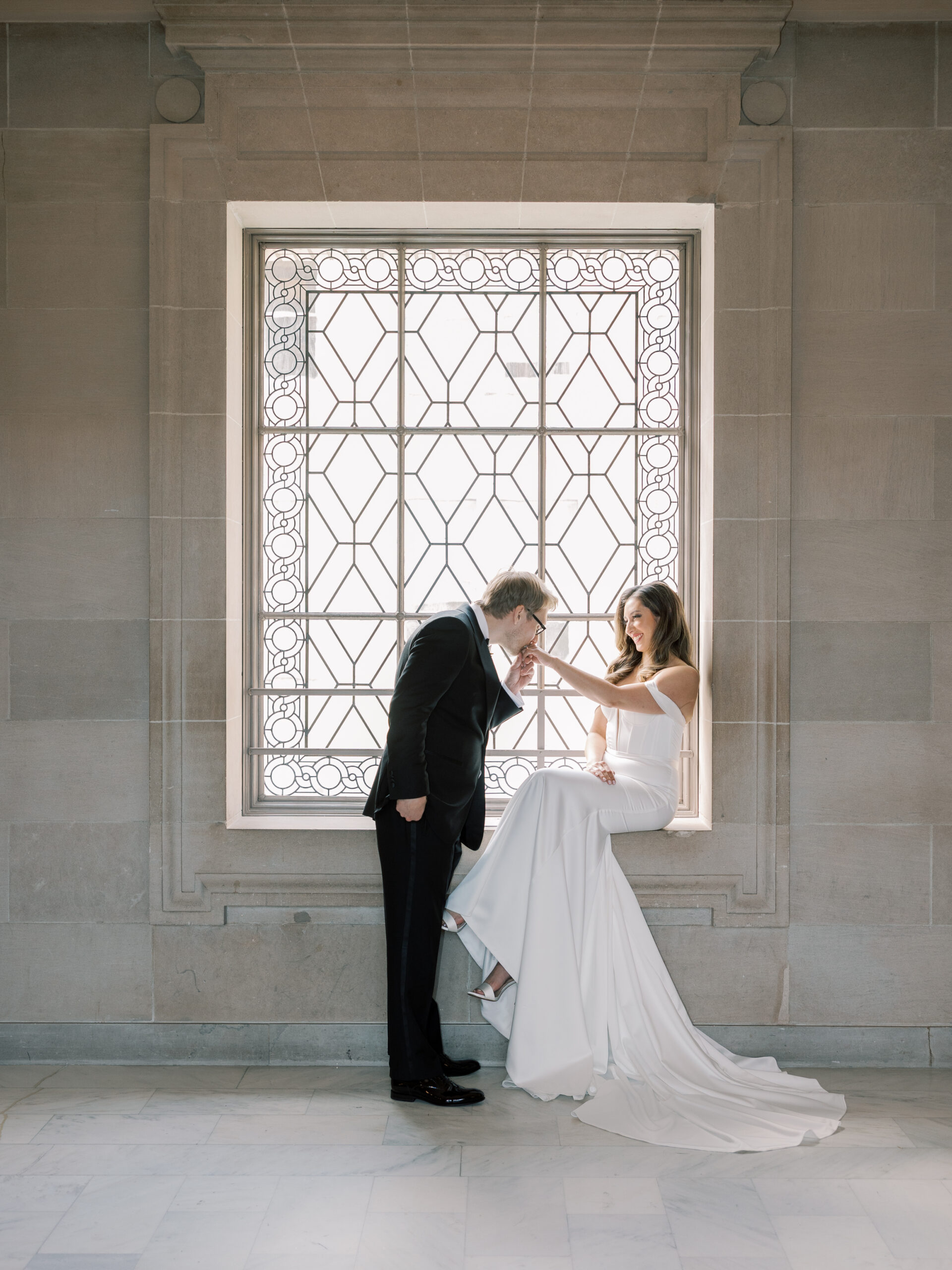 Marcella and Patrick exchanging vows alone on the 4th floor of San Francisco City Hall
